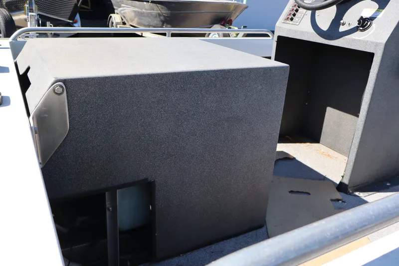 Slide: The Image of 2007 Tacoma Jet 17' Mechanic's Special boat interior, showing dashboard and seating area. - 18