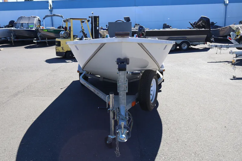 Slide: The Image of 2007 Tacoma Jet 17' Mechanic's Special boat on trailer in parking lot. - 3