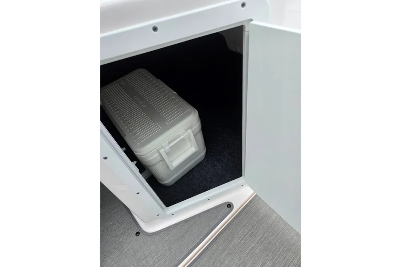 Slide: The Image of Storage compartment with cooler on 2023 Yamaha AR195 boat. - 16