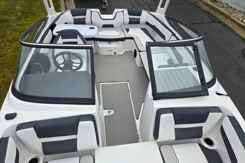 Slide: The Image of 2023 Yamaha Boats AR195 interior with sleek seating and modern dashboard design. - 21