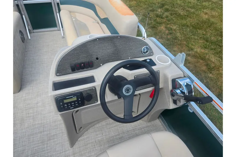 Slide: The Image of Steering console of a 2012 Avalon A Fish 16' boat with control panel and seating. - 20