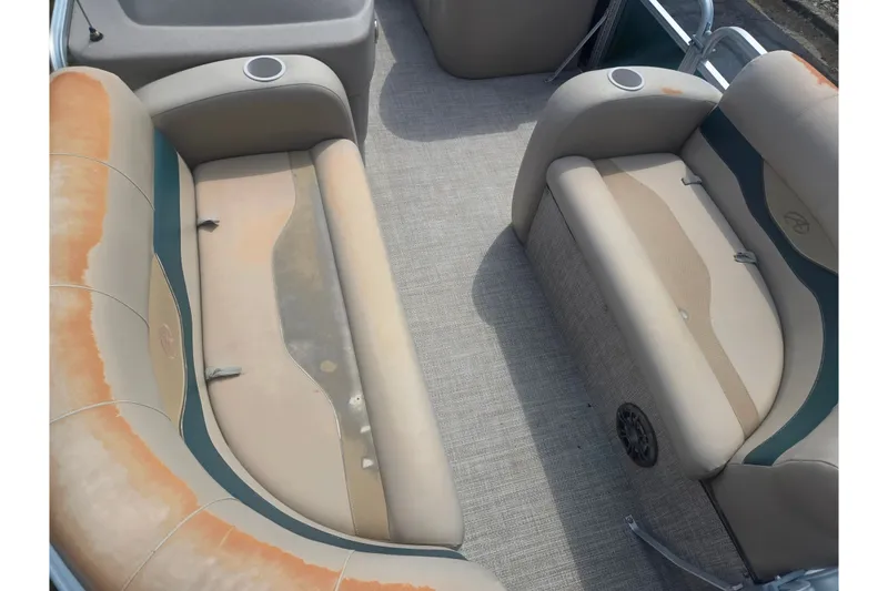 Slide: The Image of 2012 Avalon A Fish 16' boat interior with beige seating and cup holders. - 10