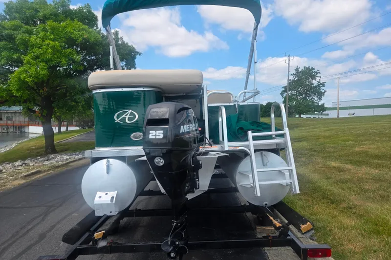 Slide: The Image of 2012 Avalon A Fish 16' pontoon boat with Mercury 25 engine on trailer. - 2