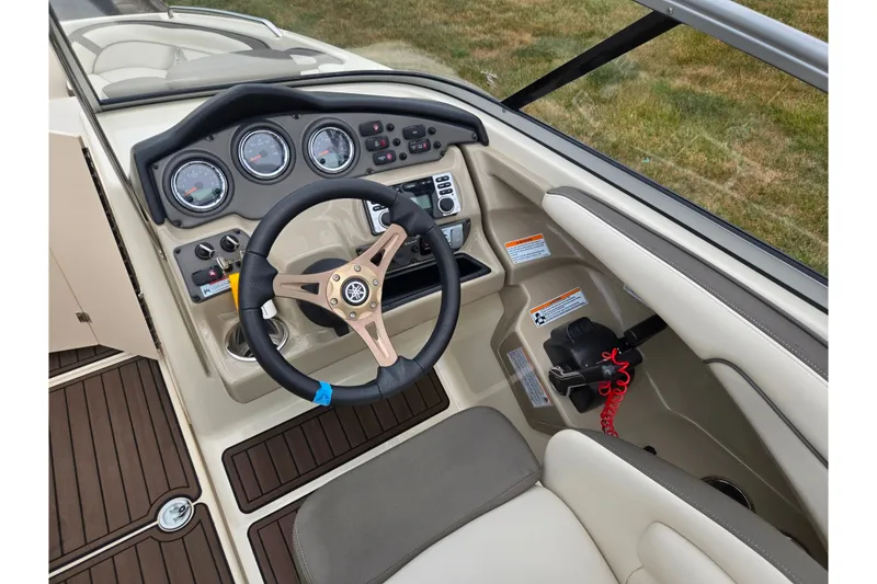 Slide: The Image of Steering console of 2014 Yamaha Boats 242 Limited S with gauges and controls. - 12