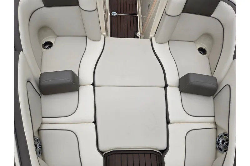 Slide: The Image of 2014 Yamaha Boats 242 Limited S interior seating, featuring luxurious white and gray upholstery. - 19