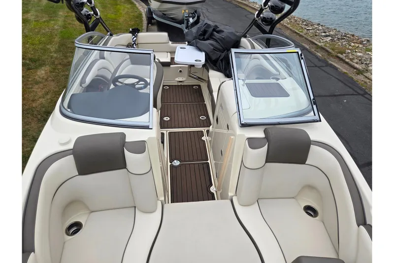 Slide: The Image of 2014 Yamaha Boats 242 Limited S interior with seating and dashboard view. - 20