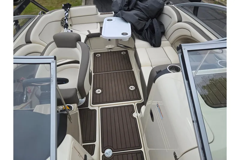 Slide: The Image of 2014 Yamaha Boats 242 Limited S interior with seating and table, featuring elegant design. - 21