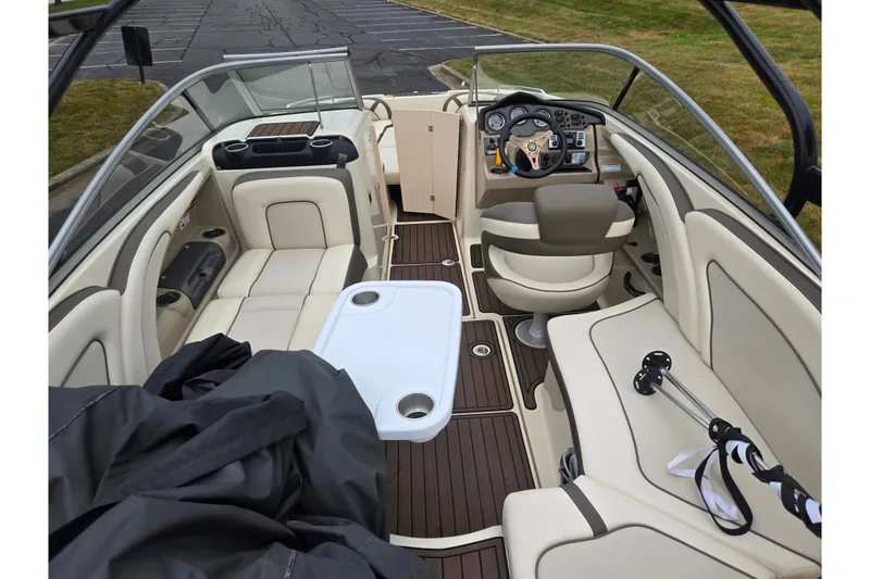 Slide: The Image of 2014 Yamaha Boats 242 Limited S interior with luxurious seating and modern dashboard. - 10