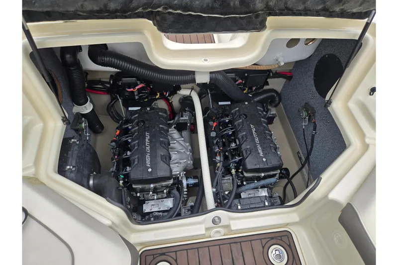 Slide: The Image of 2014 Yamaha Boats 242 Limited S engine compartment with dual high-output engines. - 24