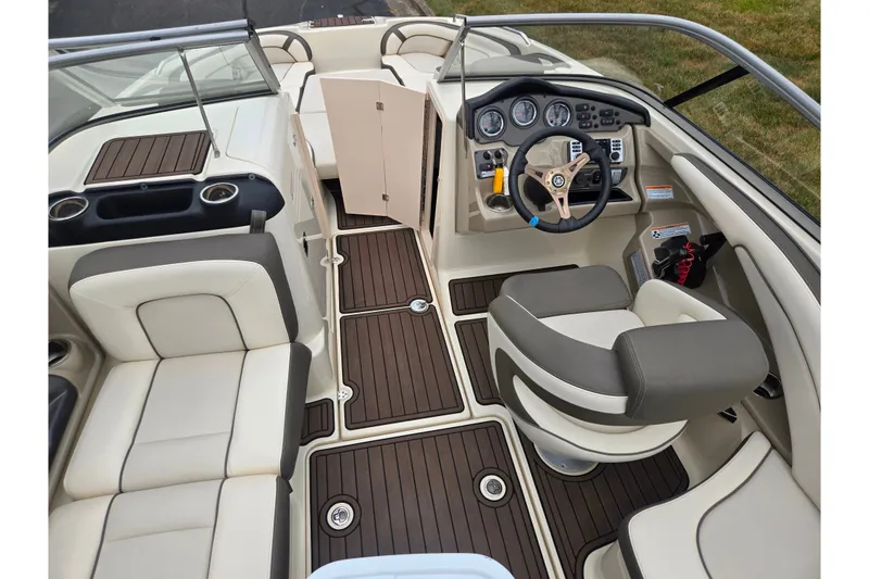 Slide: The Image of 2014 Yamaha Boats 242 Limited S interior with sleek dashboard and comfortable seating. - 11