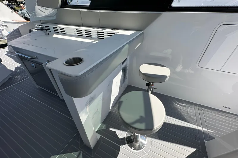 Slide: The Image of 2026 Cruisers Yachts 42 GLS OB interior with seating and counter space. - 14