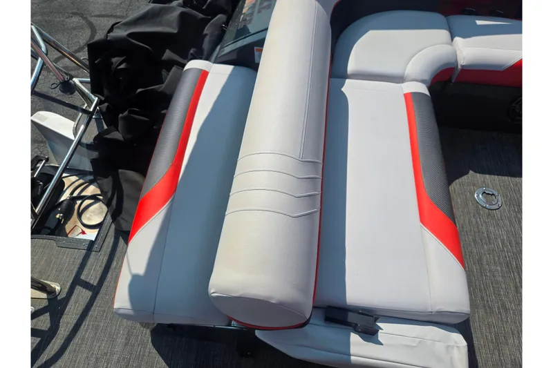 Slide: The Image of 2023 Crest Caribbean RS 230 boat interior with red and gray seating. - 24