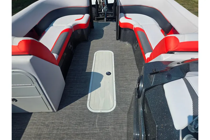 Slide: The Image of 2023 Crest Caribbean RS 230 interior with red and white seating, gray flooring. - 16