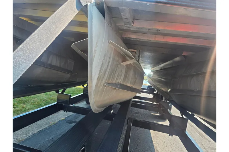 Slide: The Image of 2023 Crest Caribbean RS 230 pontoon boat underside on trailer. - 7