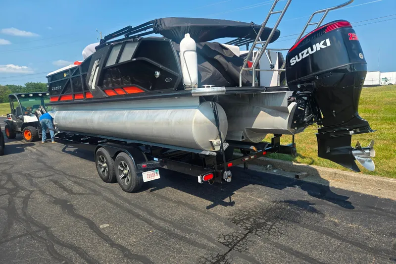 Slide: The Image of 2023 Crest Caribbean RS 230 pontoon boat on trailer with Suzuki outboard motor. - 3