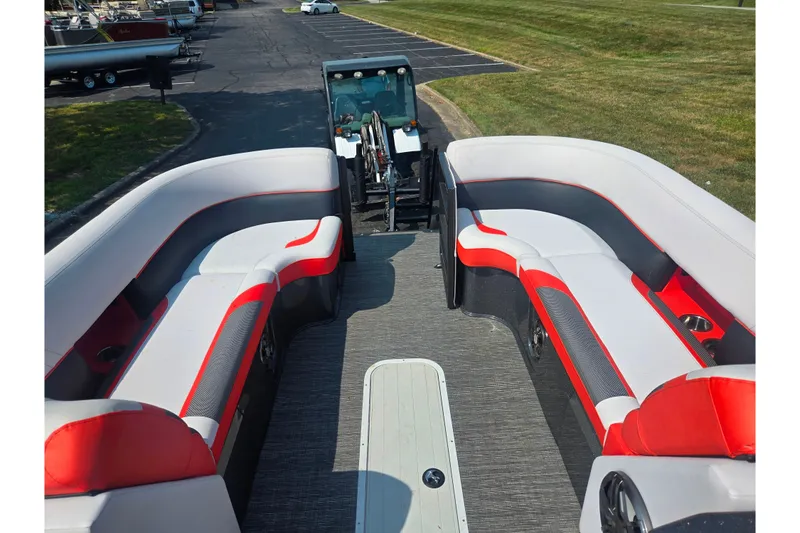 Slide: The Image of 2023 Crest Caribbean RS 230 pontoon boat with stylish red and white seating. - 17