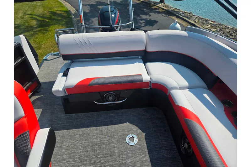 Slide: The Image of 2023 Crest Caribbean RS 230 boat interior with stylish red and gray seating. - 23