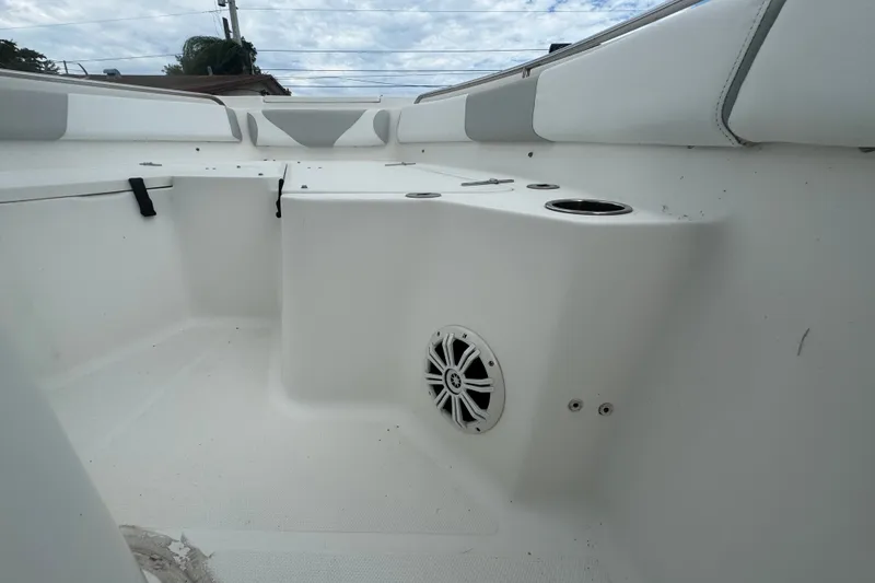 Slide: The Image of Interior view of a 2015 Sea Hunt Ultra 235SE boat, featuring seating and speaker. - 40