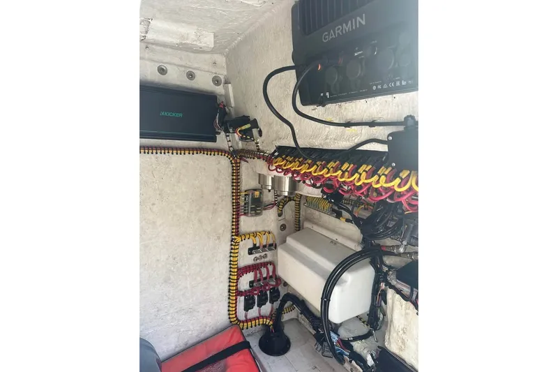 Slide: The Image of Interior wiring of a 2015 Sea Hunt Ultra 235SE boat with Garmin and Kicker equipment. - 29