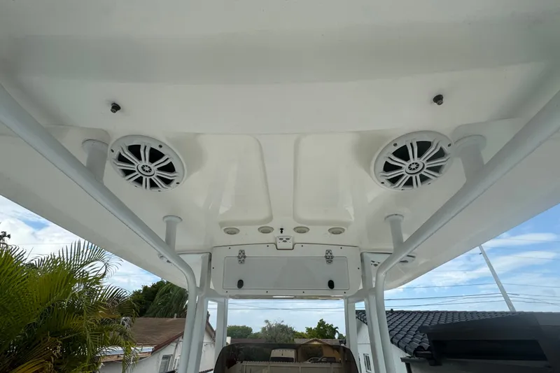 Slide: The Image of 2015 Sea Hunt Ultra 235SE boat roof with speakers and support poles. - 15