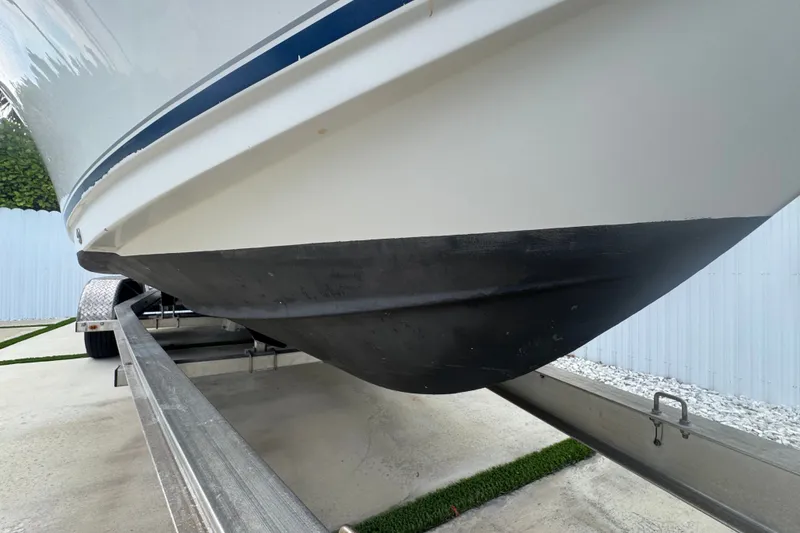 Slide: The Image of 2015 Sea Hunt Ultra 235SE boat on trailer, close-up of hull and keel. - 43