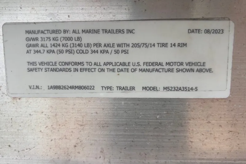 Slide: The Image of Label on trailer with specifications and compliance details, dated August 2023. - 54