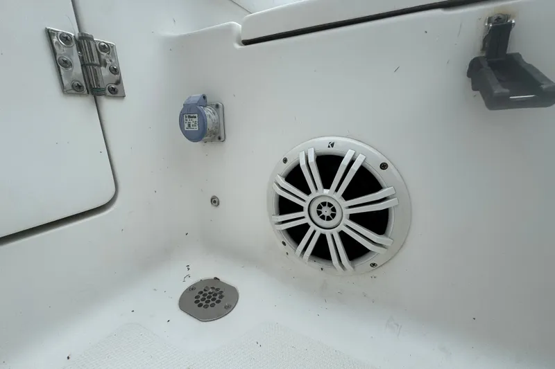 Slide: The Image of 2015 Sea Hunt Ultra 235SE boat interior with speaker and drain. - 41