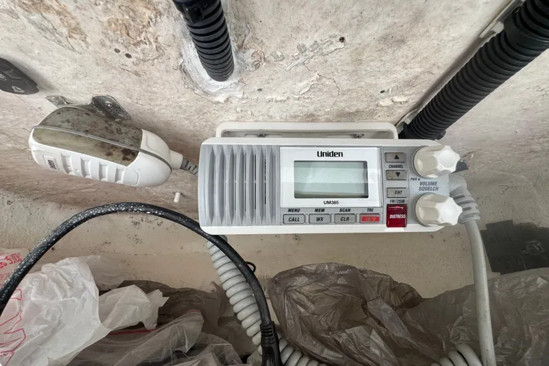 Slide: The Image of Uniden UM385 radio installed on a 2015 Sea Hunt Ultra 235SE boat. - 24