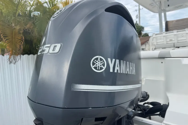 Slide: The Image of A Yamaha 250 outboard motor is mounted on a Sea Hunt Ultra 235SE boat. - 52