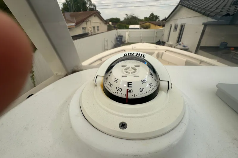 Slide: The Image of Compass on 2015 Sea Hunt Ultra 235SE boat, showing east direction. - 25