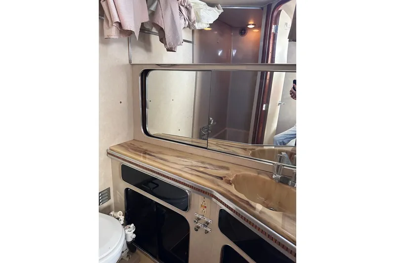 Slide: The Image of Bathroom interior of 1984 Chris-Craft 381 Catalina yacht with mirror and sink. - 34