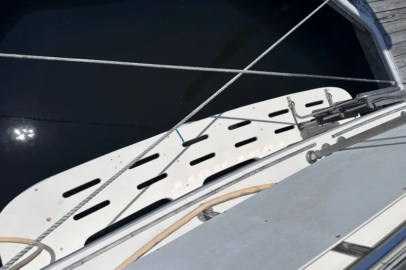 Slide: The Image of 1984 Chris-Craft 381 Catalina boat deck with ropes and dock view. - 9