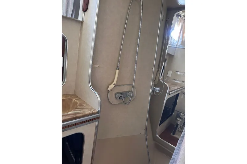 Slide: The Image of 1984 Chris-Craft 381 Catalina bathroom interior with shower and sink. - 26