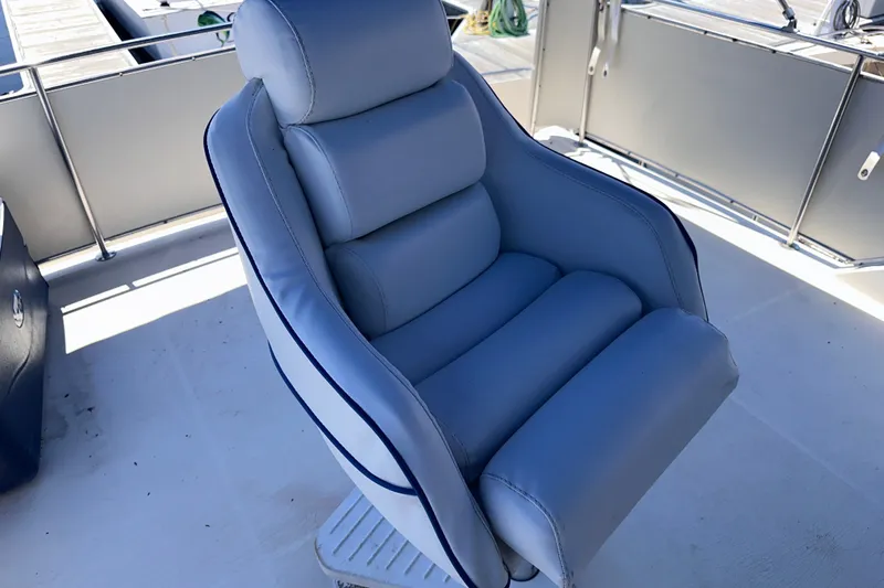 Slide: The Image of Comfortable captain's chair on 1984 Chris-Craft 381 Catalina yacht deck. - 12