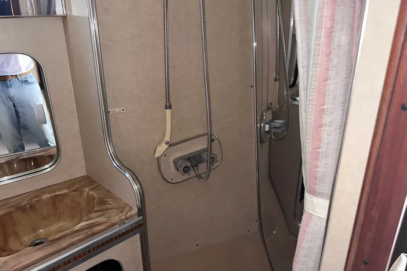 Slide: The Image of Interior of 1984 Chris-Craft 381 Catalina bathroom with shower and sink. - 23