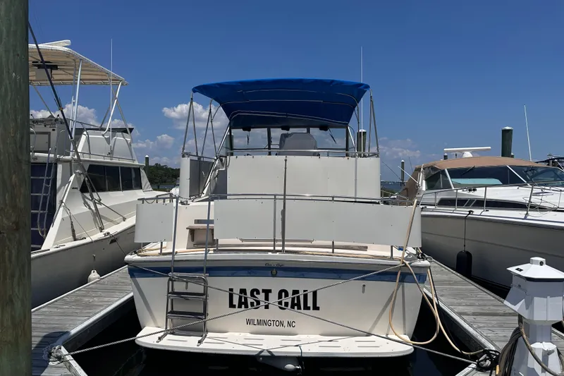 Slide: The Image of 1984 Chris-Craft 381 Catalina docked in Wilmington, NC, with blue canopy. - 3