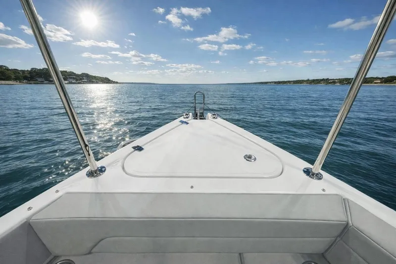 Slide: The Image of 2026 Cruisers Yachts 38 VTR on open water under sunny sky. - 18