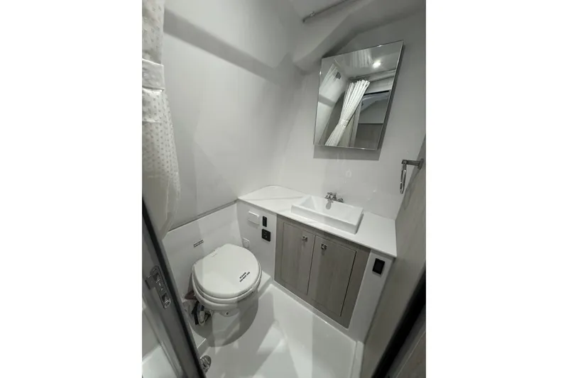 Slide: The Image of Modern bathroom in 2026 Cruisers Yachts 38 VTR, featuring sleek fixtures and minimalist design. - 13