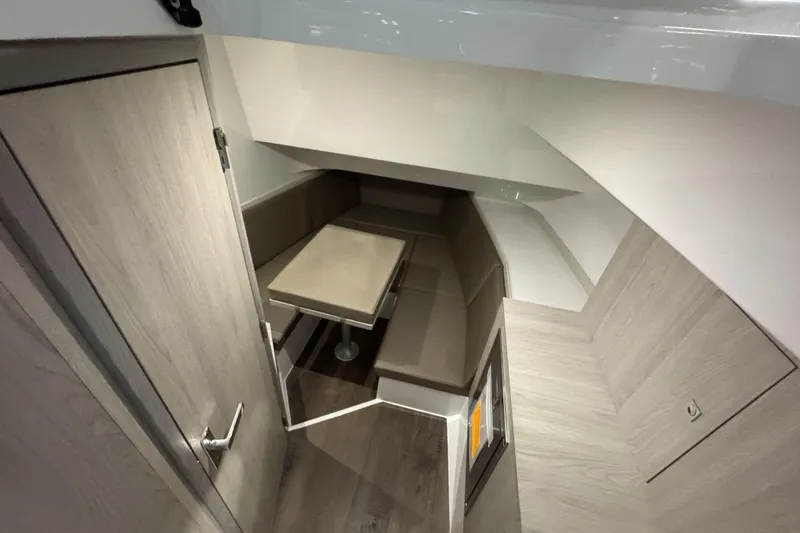 Slide: The Image of 2026 Cruisers Yachts 38 VTR interior with modern seating and table arrangement. - 11