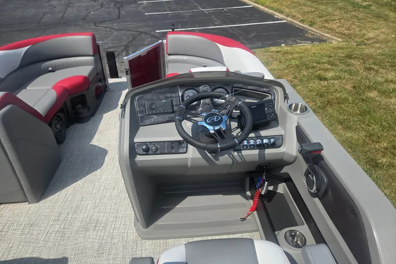 Slide: The Image of 2024 Avalon LSZ Cruise Bench boat interior with steering console and seating. - 21
