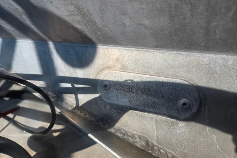 Slide: The Image of Close-up of a 2024 Avalon LSZ Cruise Bench metal surface with serial number. - 25