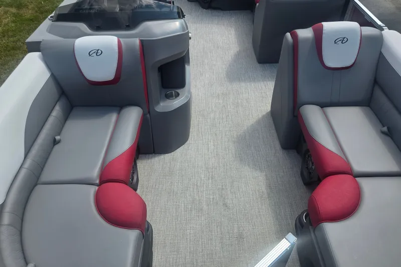 Slide: The Image of 2024 Avalon LSZ Cruise Bench interior with gray and red seating, featuring cup holders and modern design. - 10