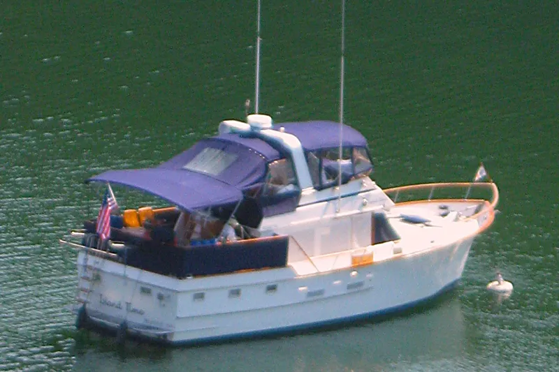 Slide: The Image of 1983 Ocean Alexander 43 Flush Aft Deck yacht on calm water. - 2