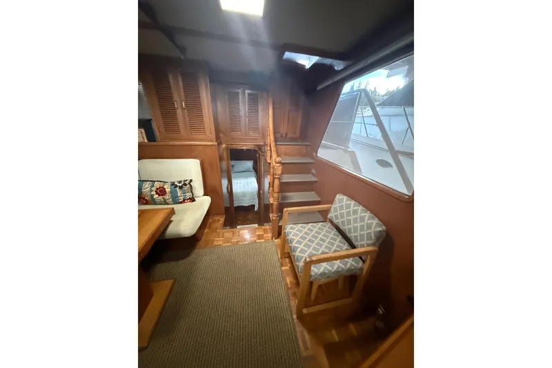 Slide: The Image of Interior of 1983 Ocean Alexander 43 Flush Aft Deck yacht with wooden furnishings. - 6
