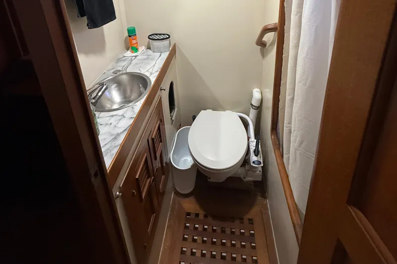 Slide: The Image of Bathroom interior of a 1978 DeFever 39 yacht with sink and toilet. - 5
