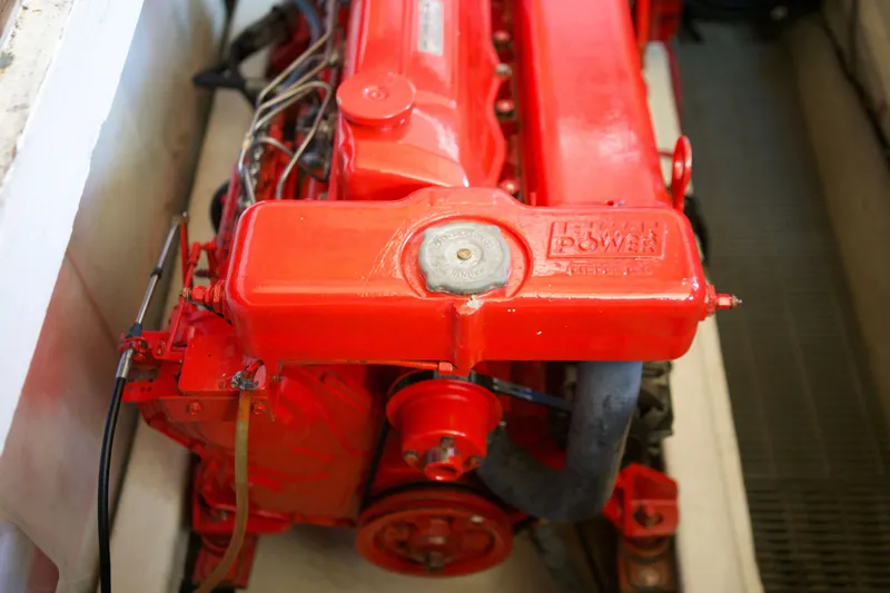 Slide: The Image of Red engine of a 1978 DeFever 39 boat, showcasing Lehman Power branding. - 14