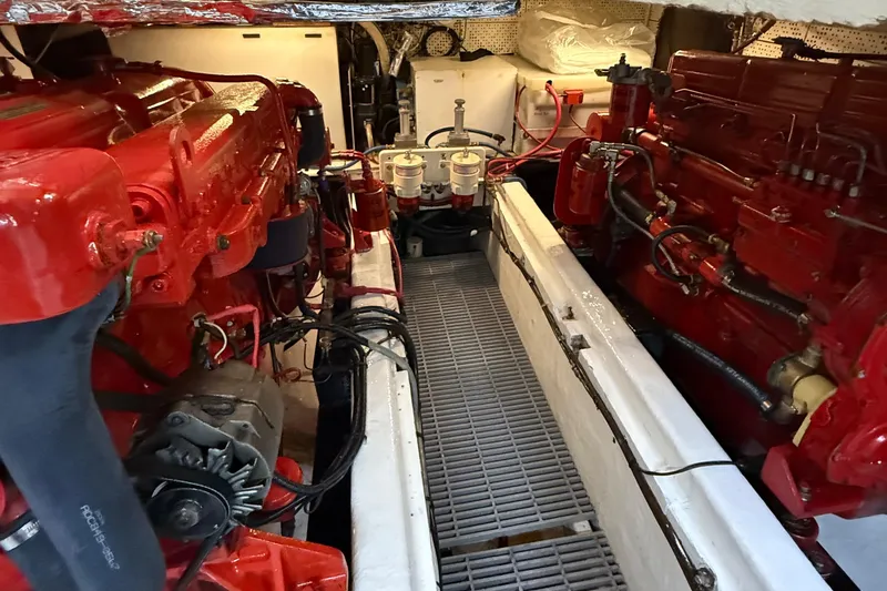 Slide: The Image of Engine room of a 1978 DeFever 39 boat with red machinery and components. - 3