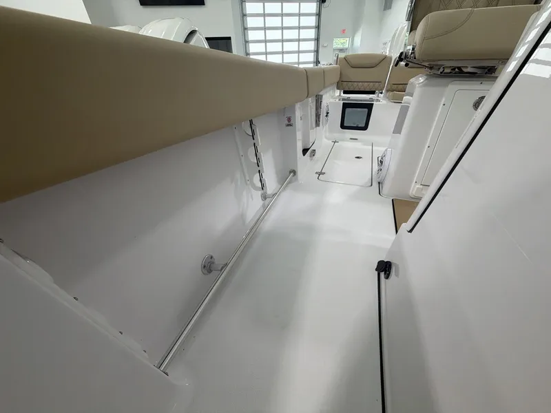 Slide: The Image of Interior view of a modern sports boat with white surfaces and beige upholstery. - 5
