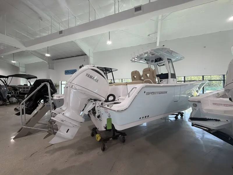 Slide: The Image of A 2027 Sportsman Heritage 261 Center Console boat is displayed in a showroom. - 6