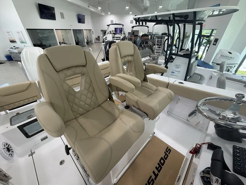 Slide: The Image of Two luxurious, padded captain's chairs in a modern boat interior. - 13